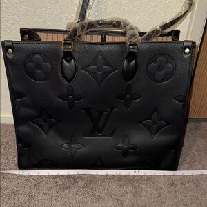 Black Embossed Monogram Bag